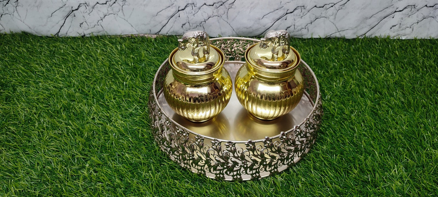 Silver tray with golden jar