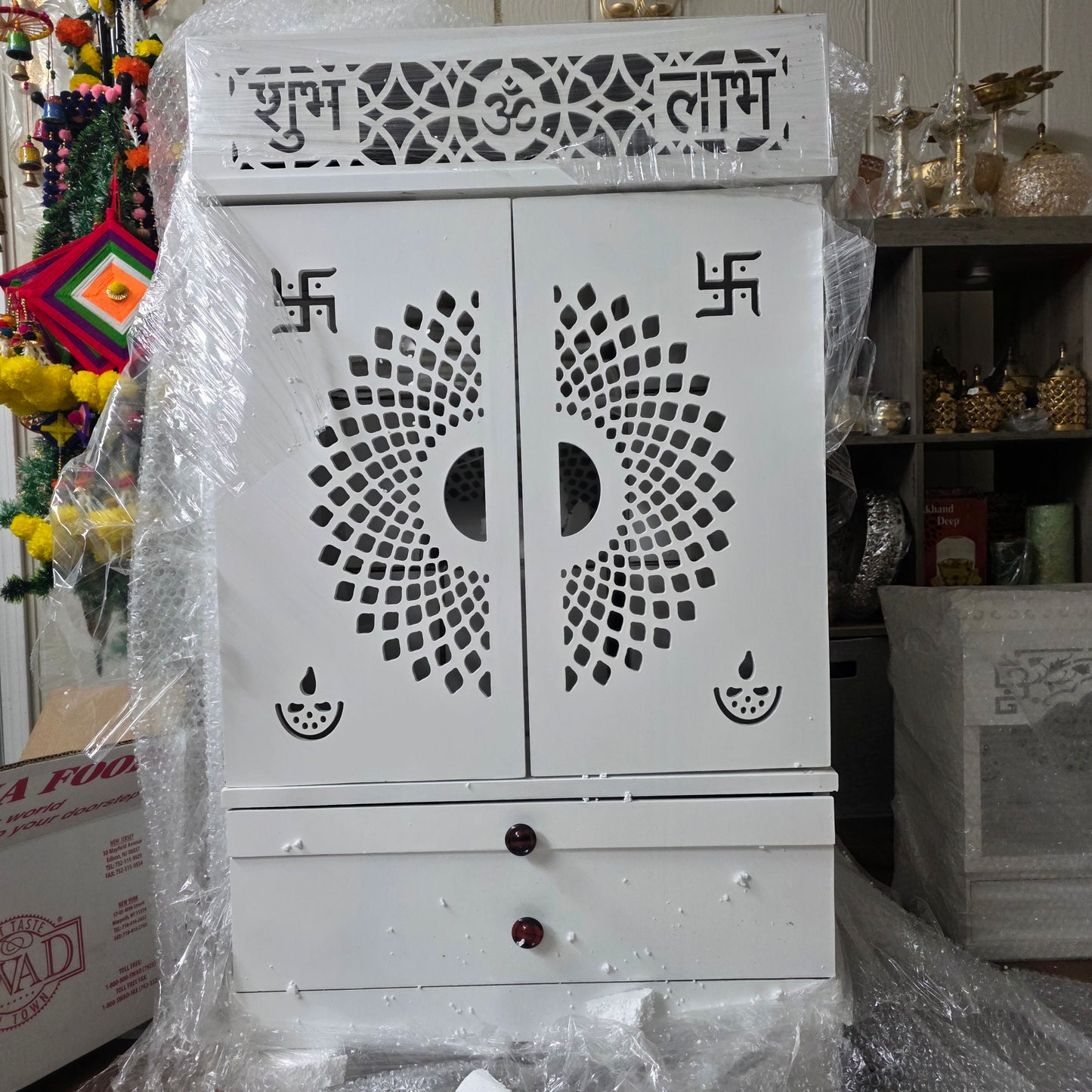 White wooden temple with drawer and lights