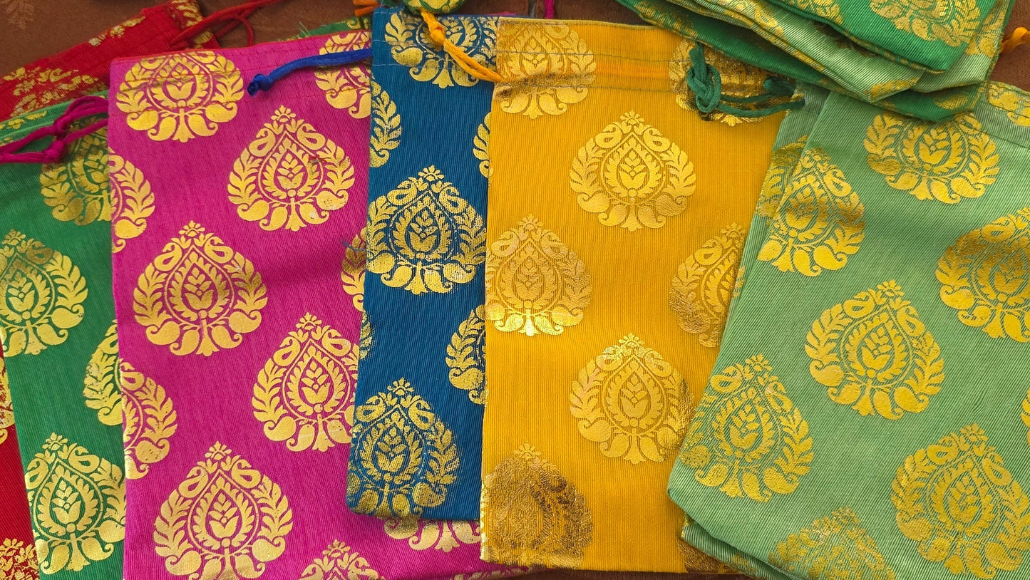 Collection of colorful fabric bags with yellow floral patterns