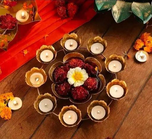 Metal flower rangoli with center urli