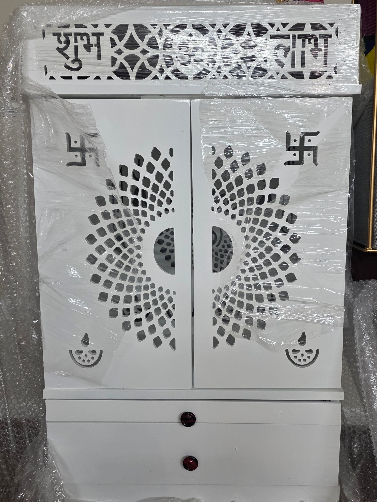 White wooden temple with drawer and lights